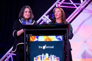TMA volunteers Sharon Manewitz and Jennifer Meyerowitz present awards at the TMA Annual Conference